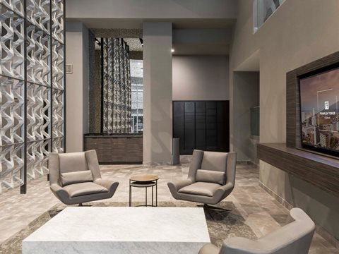 A welcoming gathering space with seating at Franklin Tower